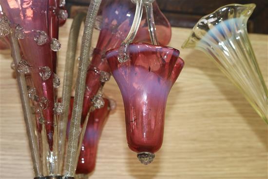 A Victorian cranberry glass epergne and a pale yellow vaseline glass epergne